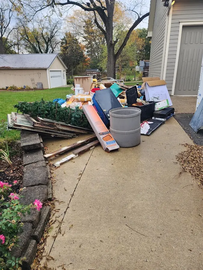 Dumpster being loaded with debris for Commercial Dumpster Rental in Warrenton
